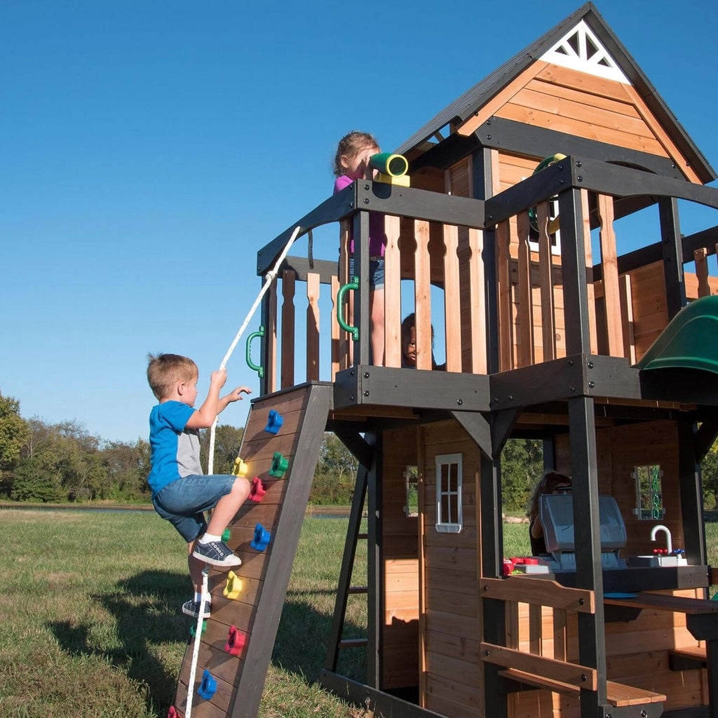 Backyard Discovery Canyon Creek Cedar Wood Swing Set with Wave Slide, Clubhouse, Play Kitchen, Picnic Area, Belt Swings, Web Swing, Rock Wall, Balconies, Playhouse, Step Ladder, Outdoor Playset