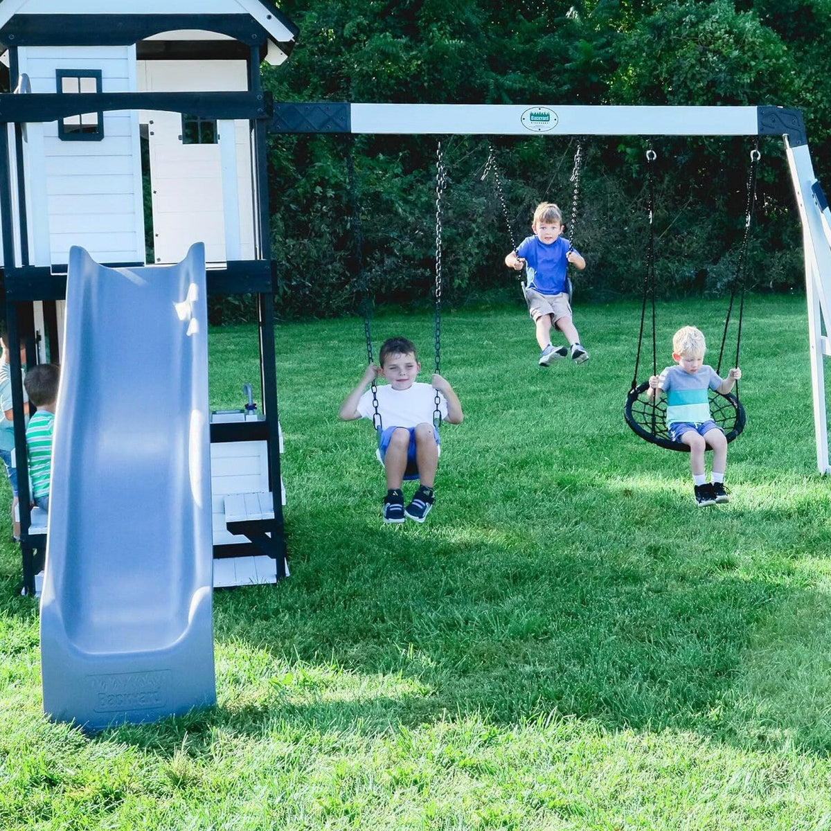 Backyard Discovery Canyon Creek Cedar Wood Swing Set with Wave Slide, Clubhouse, Play Kitchen, Picnic Area, Belt Swings, Web Swing, Rock Wall, Balconies, Playhouse, Step Ladder, Outdoor Playset